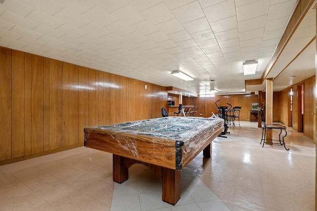 game room featuring billiards and wood walls