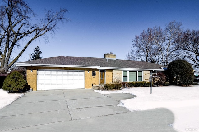 ranch-style house featuring a garage