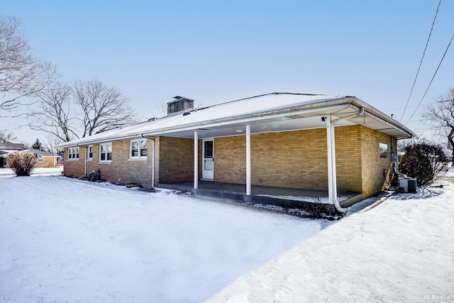 view of snow covered property