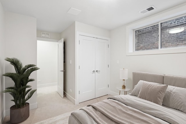 carpeted bedroom with a closet