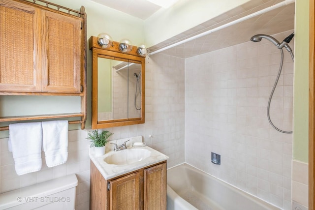 full bath featuring bathing tub / shower combination, toilet, and vanity