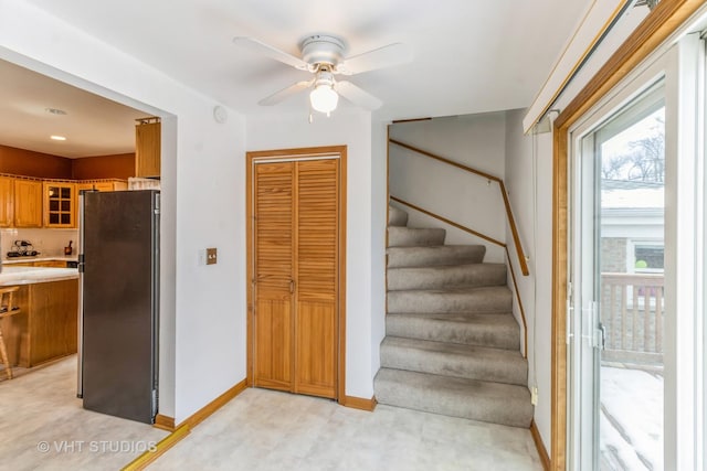 staircase with ceiling fan