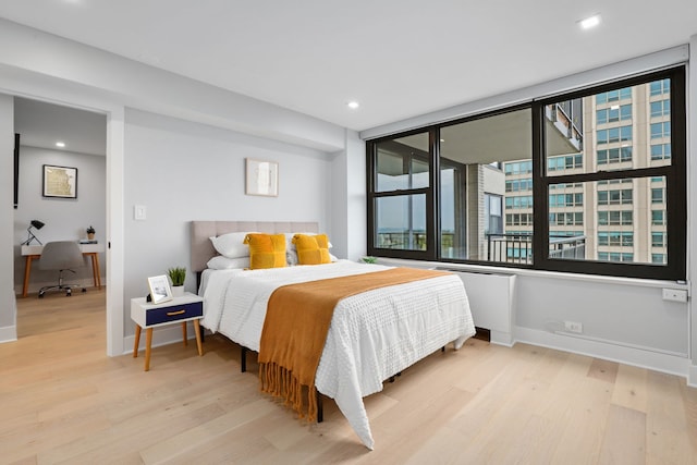 bedroom with light hardwood / wood-style floors