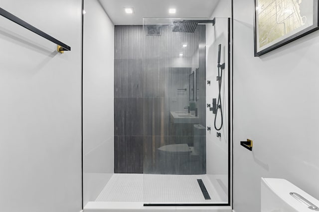 bathroom featuring toilet and walk in shower