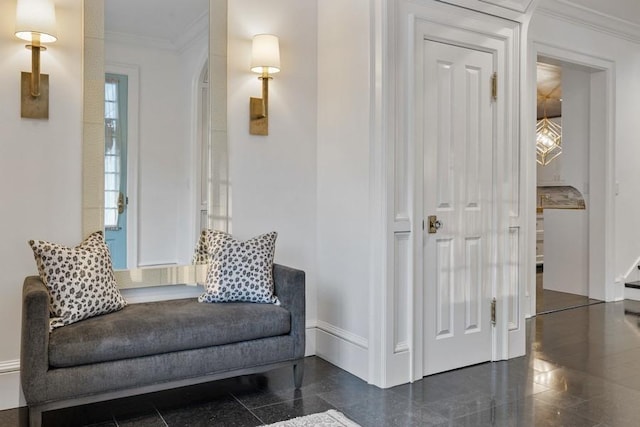 sitting room featuring ornamental molding