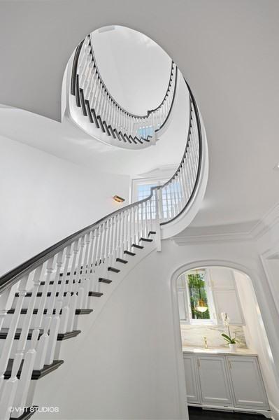 staircase featuring a high ceiling