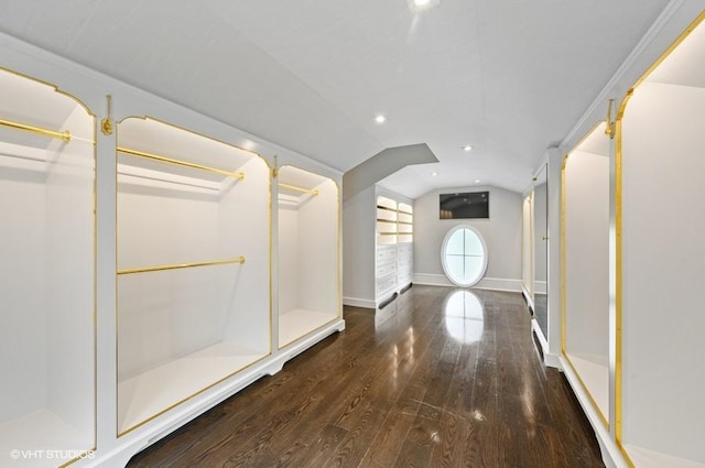 hall featuring dark hardwood / wood-style flooring and vaulted ceiling