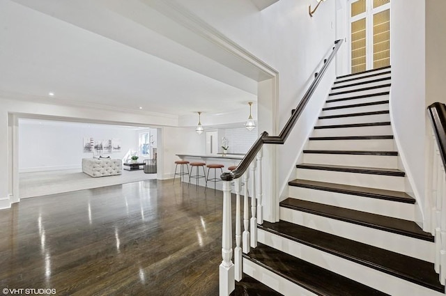 stairway with wood-type flooring