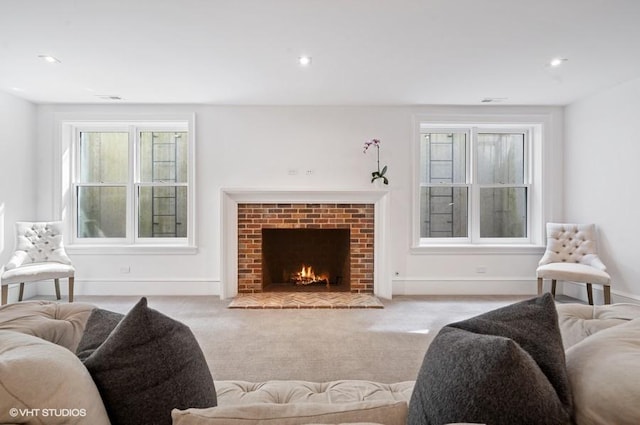 carpeted living room featuring a fireplace