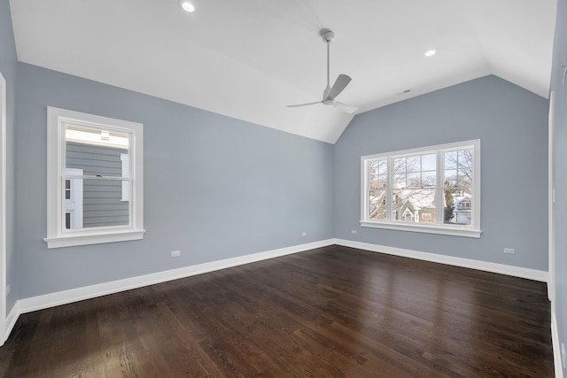 empty room with ceiling fan, vaulted ceiling, and hardwood / wood-style floors