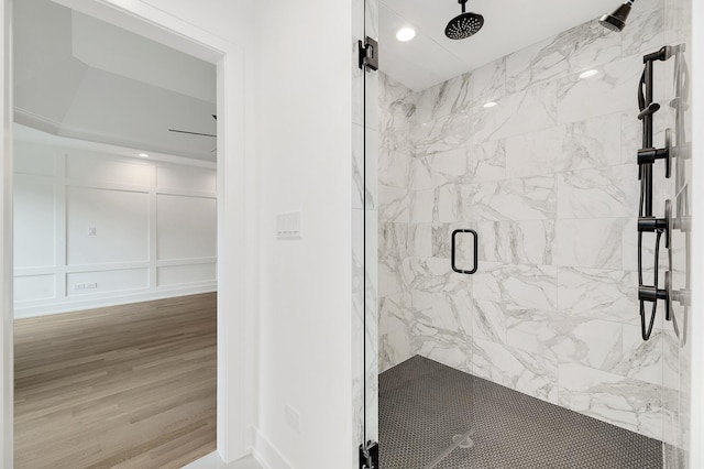 bathroom featuring hardwood / wood-style floors and an enclosed shower