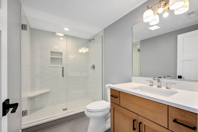 bathroom with toilet, tile patterned flooring, an enclosed shower, and vanity