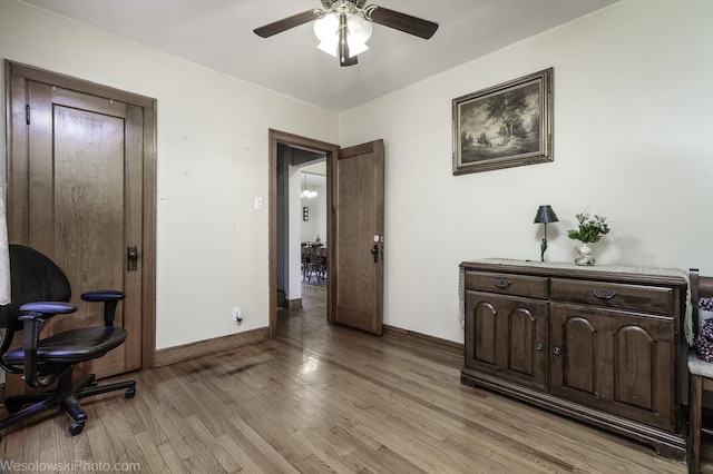 office area with ceiling fan and light wood-type flooring