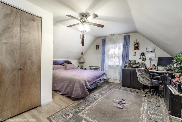 bedroom featuring vaulted ceiling, ceiling fan, and hardwood / wood-style flooring