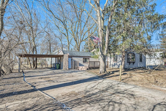 ranch-style house featuring a carport