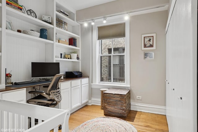 home office featuring light hardwood / wood-style floors