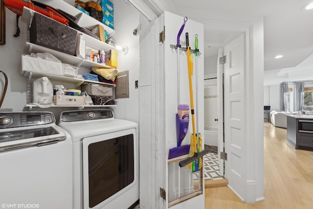 laundry room featuring light hardwood / wood-style flooring and independent washer and dryer