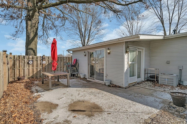 exterior space with central AC and a patio area