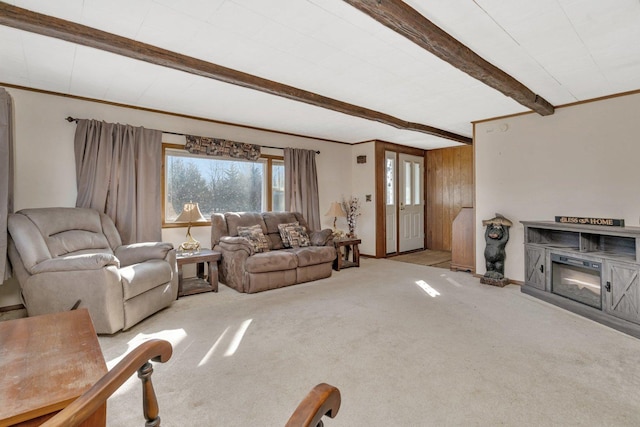 living room with beam ceiling, light colored carpet, and wood walls