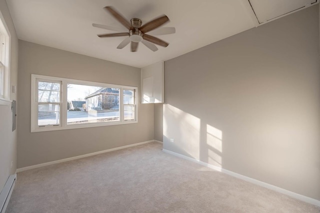 carpeted empty room featuring ceiling fan and baseboard heating