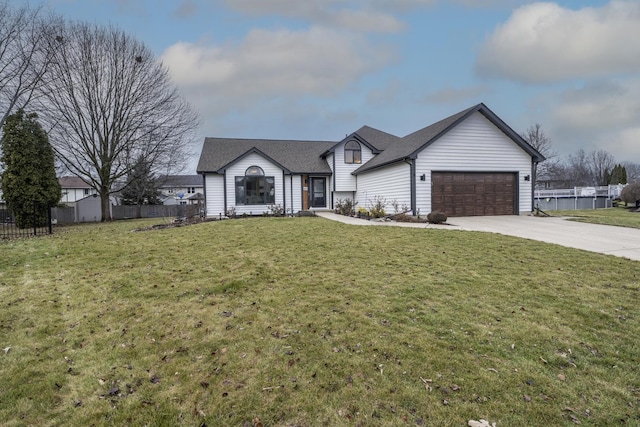 view of front of home with a front yard and a garage