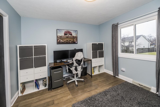 office space featuring dark wood-type flooring