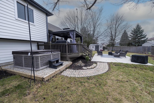 view of yard with a patio, a gazebo, cooling unit, a storage unit, and a deck