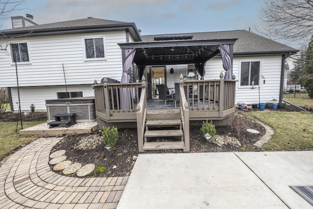 rear view of house with a deck