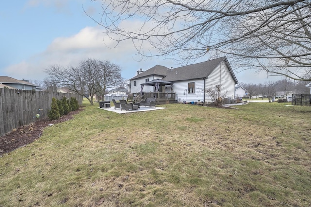 view of yard featuring a patio, an outdoor living space, and a gazebo