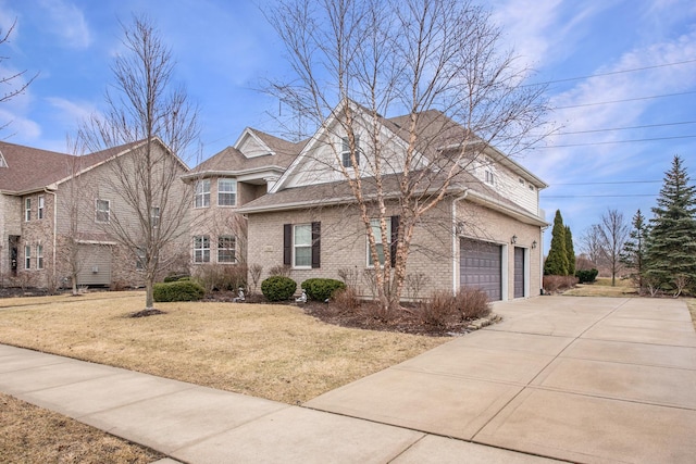 view of front facade featuring a garage and a front yard