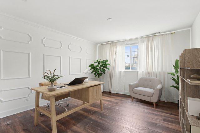 office with ornamental molding and dark hardwood / wood-style floors