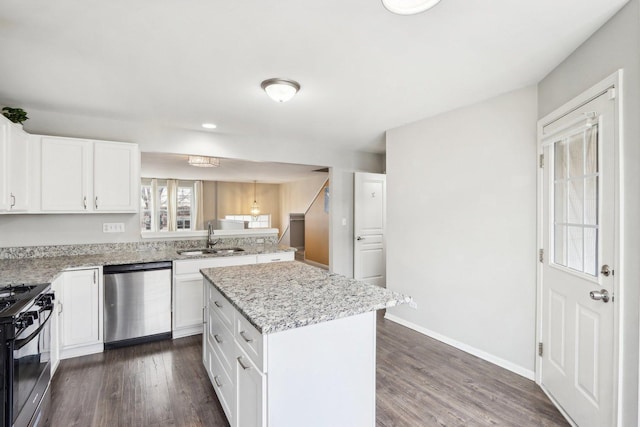 kitchen with sink, gas stove, white cabinetry, a center island, and stainless steel dishwasher