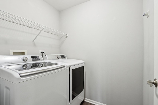 washroom with washer and dryer