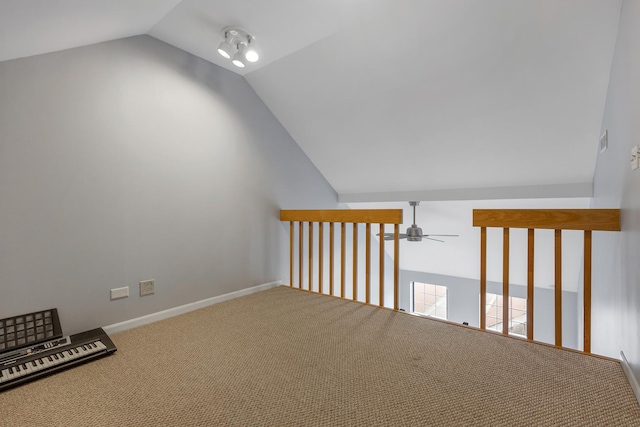 interior space featuring visible vents, carpet flooring, vaulted ceiling, ceiling fan, and baseboards