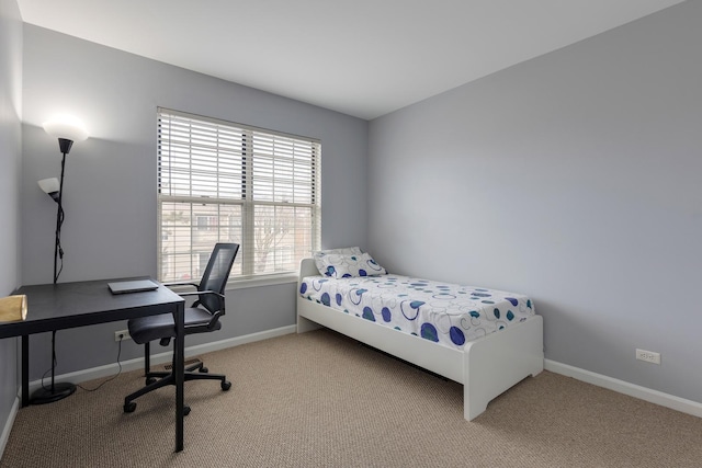 bedroom featuring baseboards and carpet flooring