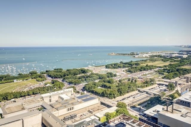 birds eye view of property featuring a water view