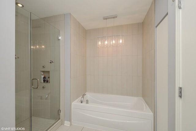 bathroom with tile patterned floors and plus walk in shower