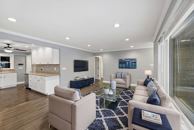 living room featuring ceiling fan, crown molding, and dark hardwood / wood-style floors