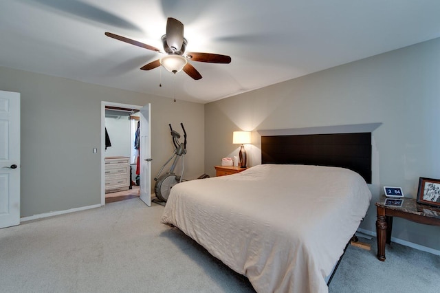 bedroom featuring light colored carpet and ceiling fan