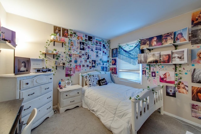 bedroom featuring light carpet