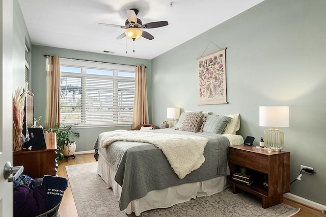 bedroom featuring light wood-type flooring and ceiling fan