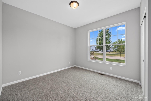 view of carpeted spare room