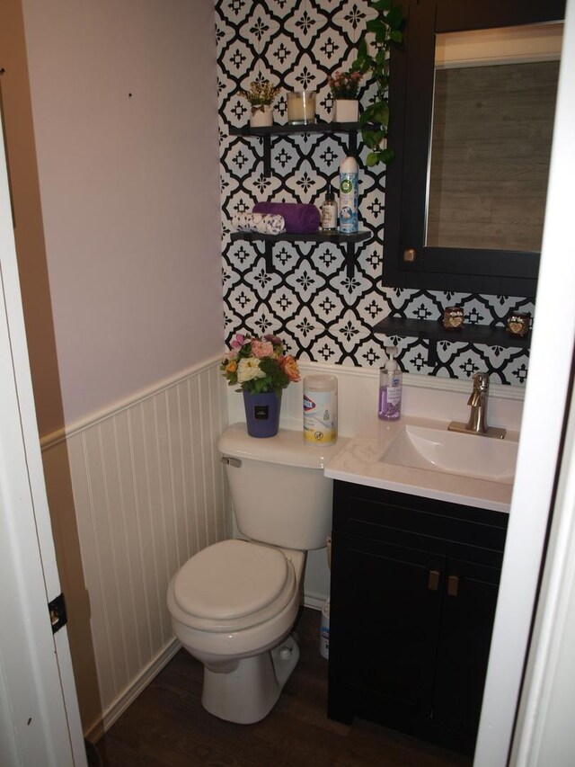 bathroom featuring toilet and vanity