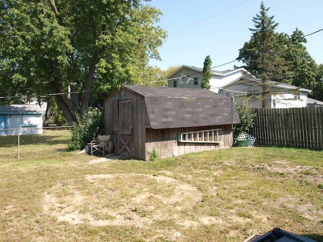 view of outbuilding featuring a yard