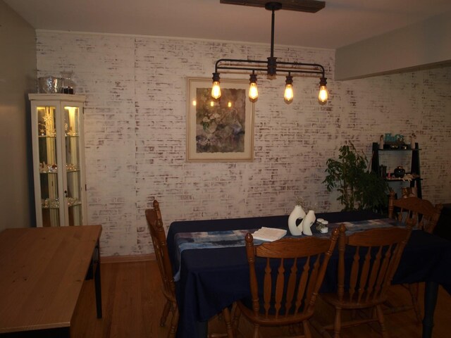 dining space with hardwood / wood-style flooring