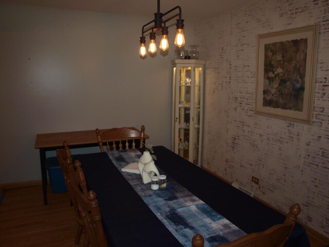 dining area featuring wood-type flooring