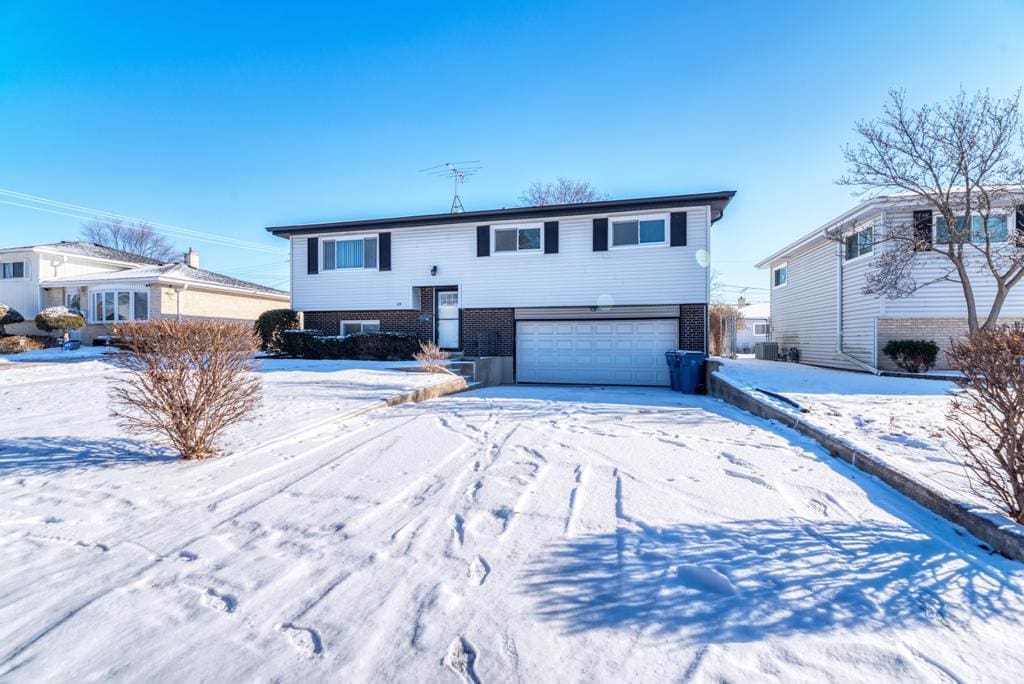 bi-level home featuring a garage