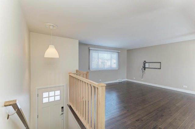 spare room featuring dark hardwood / wood-style flooring