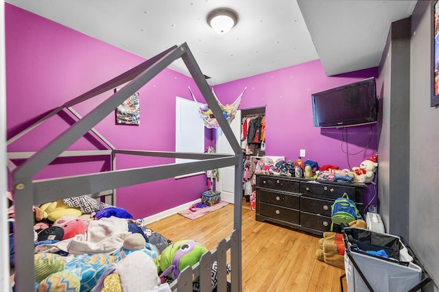 bedroom with hardwood / wood-style flooring