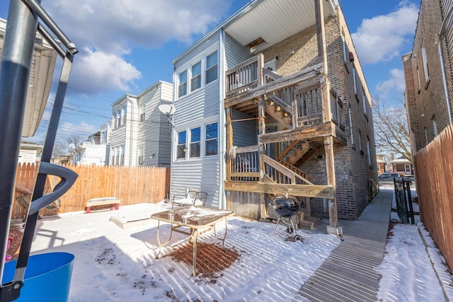 view of snow covered house